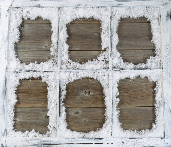 Vintage window covered in powdered snow with rustic wood in back Stock photo © tab62