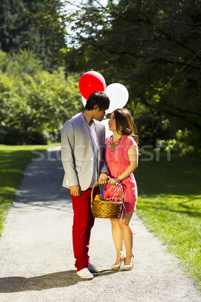 Young Adult Couple Looking into each others eyes while going on  Stock photo © tab62