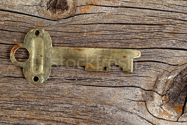 Vintage key on rustic wood  Stock photo © tab62