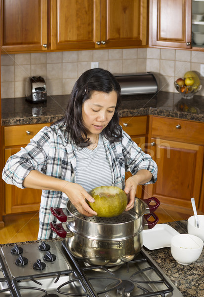 Transferring Cooked Winter Melon from Cooking Pot to Dinner Plat Stock photo © tab62
