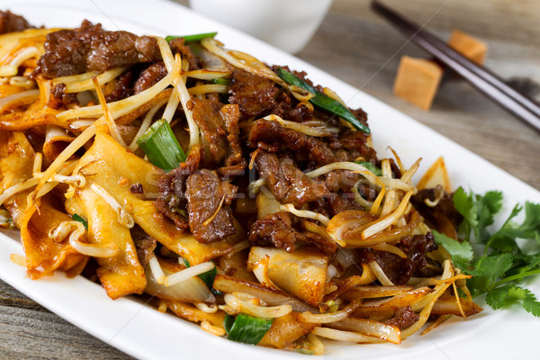 Chinese spicy beef and vegetable dish in plate setting ready to  Stock photo © tab62