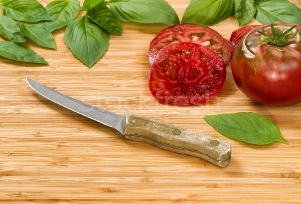 Slices of homegrown organic tomatoes on wooden cutting board  Stock photo © tab62