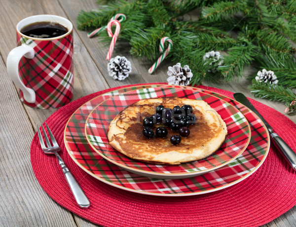 Pancake breakfast for Christmas day with evergreen branches on r Stock photo © tab62