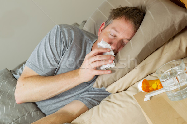 Homem maduro nariz cama foto Foto stock © tab62