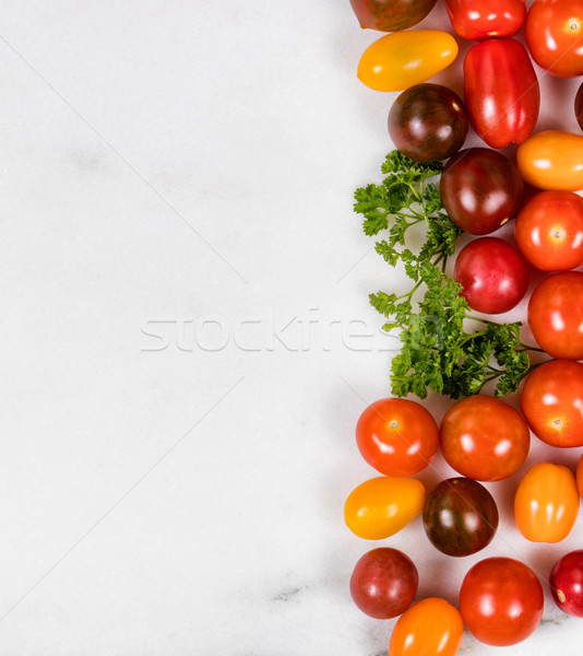 Mixed small tomatoes on white marble stone background  Stock photo © tab62