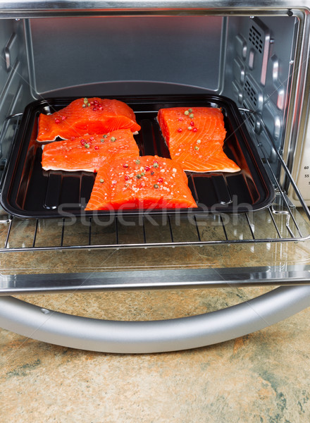 Wild Salmon being Place into Oven  Stock photo © tab62