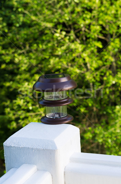 New solar lamp mounted on deck post outdoors  Stock photo © tab62