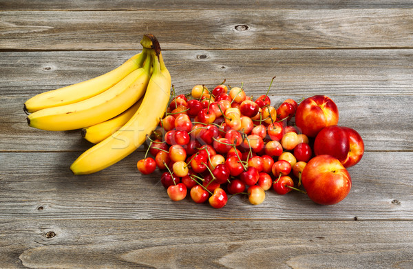 Fresh fruit displayed on rustic wood  Stock photo © tab62