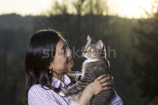 Mature woman and her cat outdoors  Stock photo © tab62