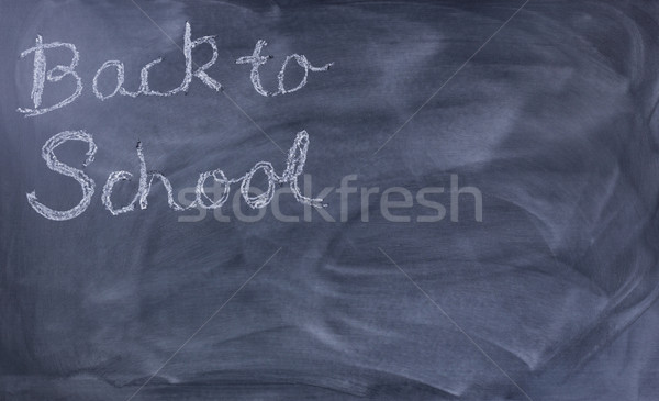 Back to school text on erased chalkboard   Stock photo © tab62