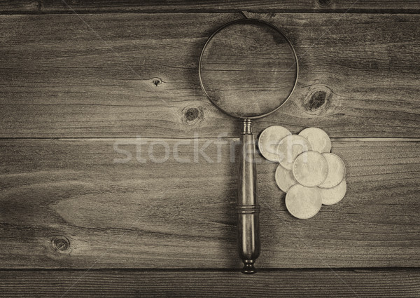 Silver dollar coin collection and round vintage magnify glass on Stock photo © tab62