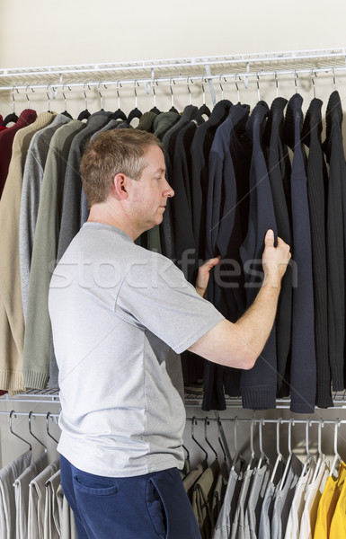 Mature man deciding what clothing to wear Stock photo © tab62