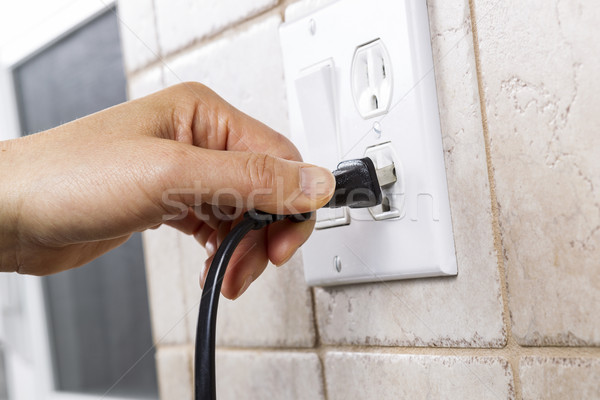 Plugging into Electrical Outlet  Stock photo © tab62