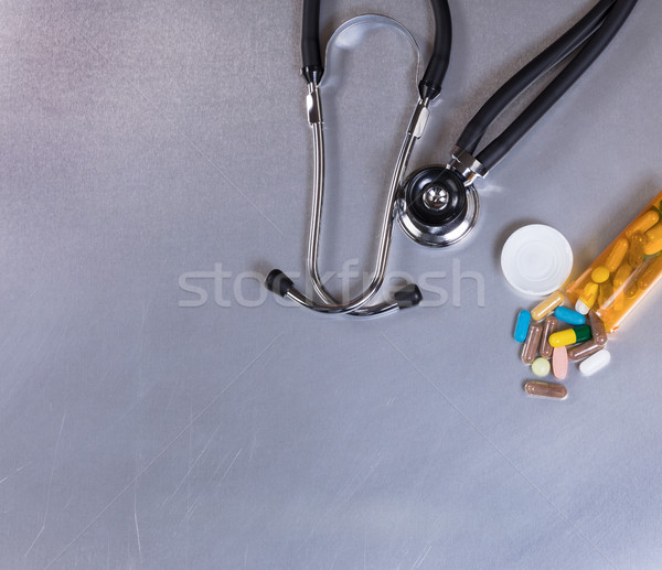 Medical stethoscope and medicine on stainless steel table  Stock photo © tab62