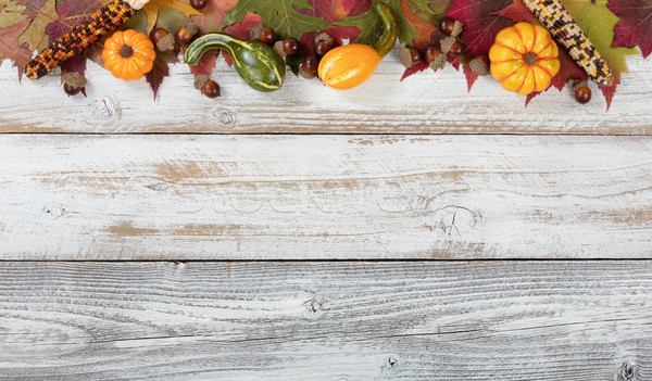 Top border of Autumn foliage with other fall decorations on whit Stock photo © tab62