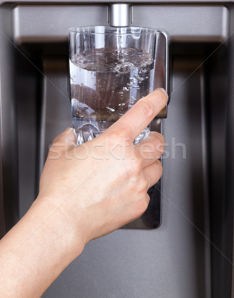 Drinking glass being filled up with filtered clean water Stock photo © tab62