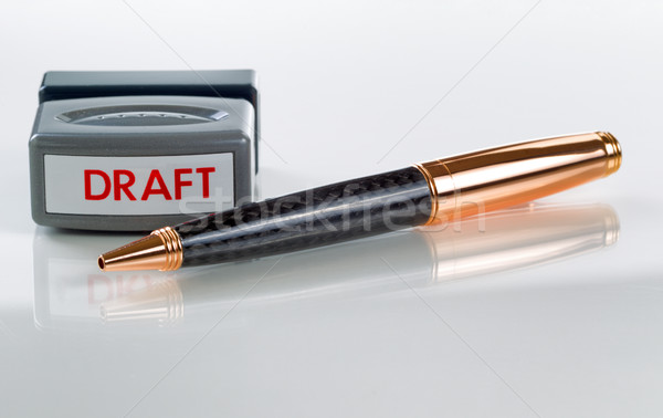 Close up of pen and draft stamp on glass table Stock photo © tab62