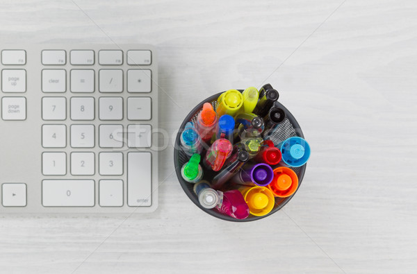 Pens and markers in container on top of desk Stock photo © tab62