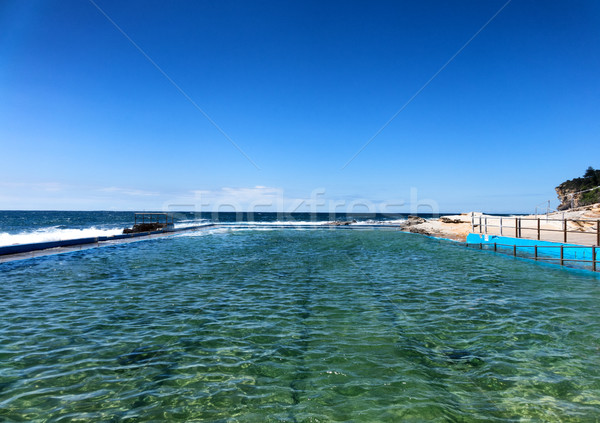 Rock swimming pool flowing into the Pacific Ocean Stock photo © tab62