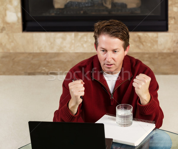 Mature Man showing positive emotion while working from home  Stock photo © tab62