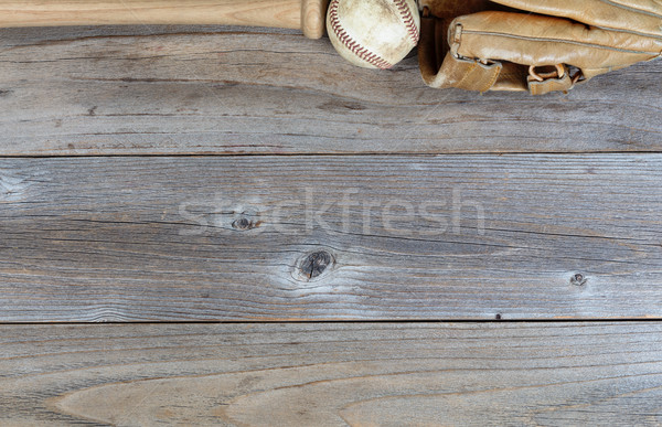Top border of used baseball equipment on rustic wooden boards Stock photo © tab62