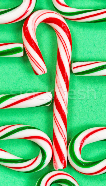 Candy canes joined in a collection on a green background  Stock photo © tab62