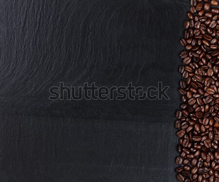 Stock photo: Roasted coffee beans on natural dark slate stone