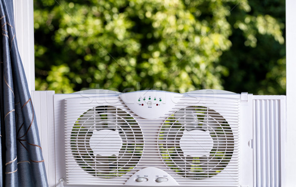 Window fan ready to cool down room in home during hot weather  Stock photo © tab62