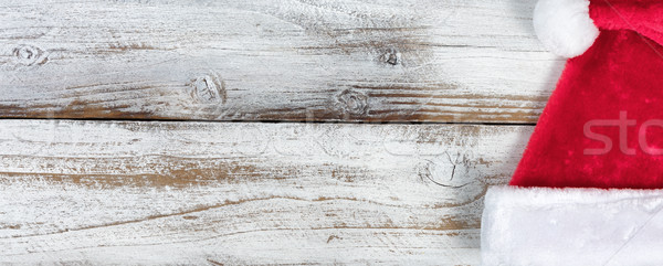 Christmas Santa Claus hat on rustic knotty white wooden backgrou Stock photo © tab62