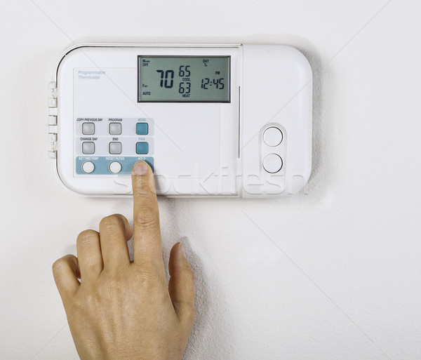 Otthon hőmérséklet kéz bent fehér fal Stock fotó © tab62