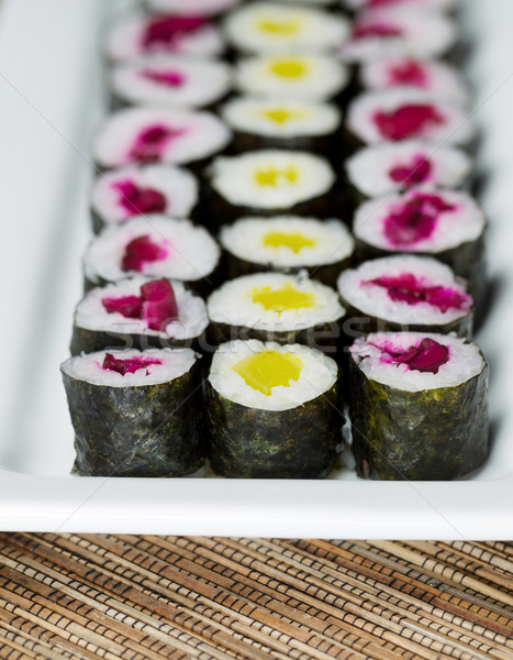 Long Plate filled with Pickled Hand Rolled Sushi  Stock photo © tab62