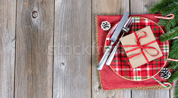 Christmas dinner setting with evergreen branches and gift box on Stock photo © tab62