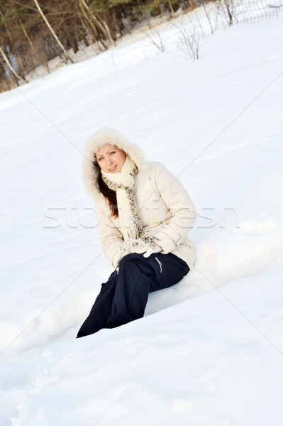  young  woman sitting at snowbank  Stock photo © taden