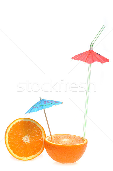 sliced orange with coctail umbrella Stock photo © taden
