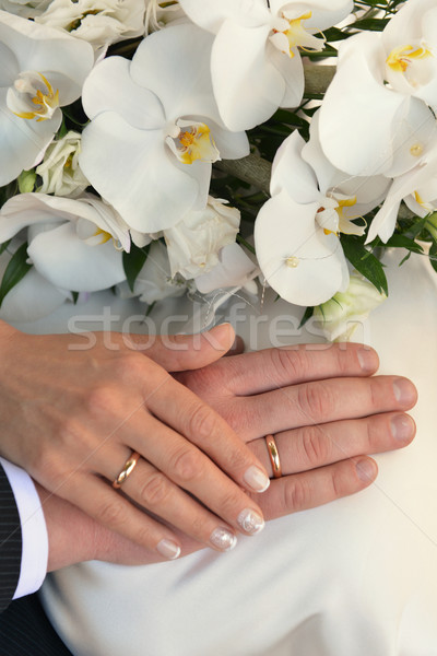 Mani fedi nuziali bouquet bianco orchidea famiglia Foto d'archivio © taden