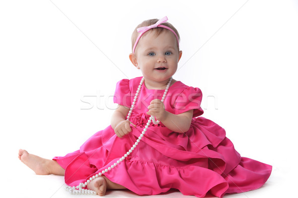 Godny podziwu mały różowy sukienka posiedzenia Zdjęcia stock © taden