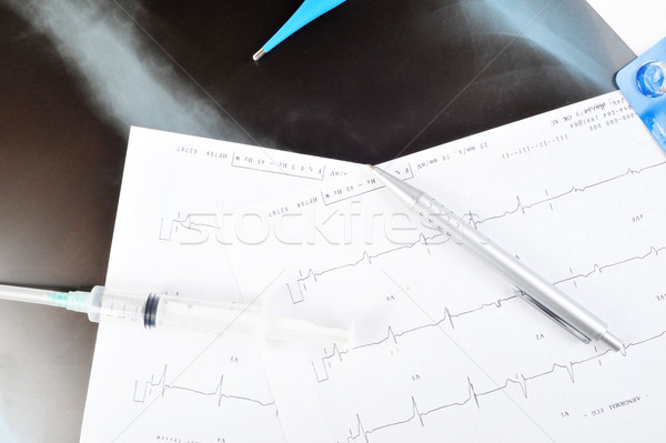 Syringe on  printout Stock photo © taden