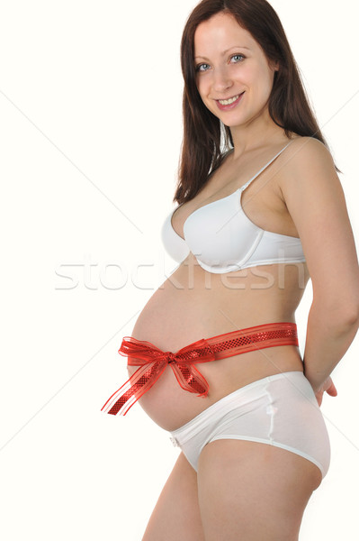 Rojo arco alrededor vientre jóvenes mujer embarazada Foto stock © taden