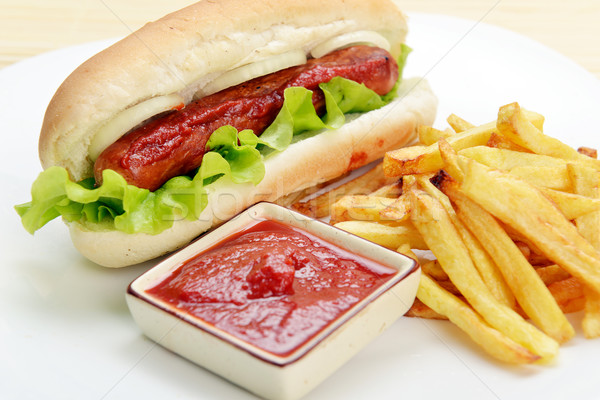 Appetitlich hot dog lecker frites weiß Platte Stock foto © taden