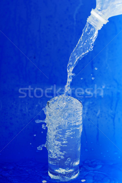 Water flows from  bottle Stock photo © taden