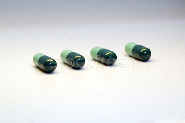 Pills on white Stock photo © taden