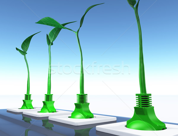 Stock photo: Small plants plugged in the sockets