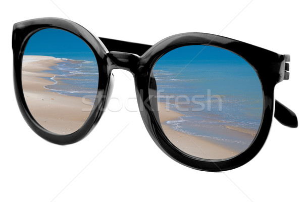 Summertime concept -  Sunglasses have a beach  reflecting on  is Stock photo © Taiga