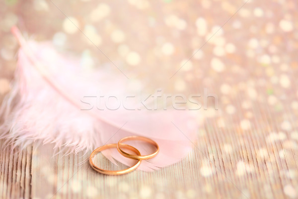 Wedding  Background with gold Rings, pink feather and magical li Stock photo © Taiga