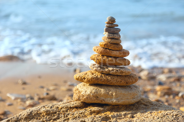 Stock photo: Stones balance and blue sea on defocused background - summertime