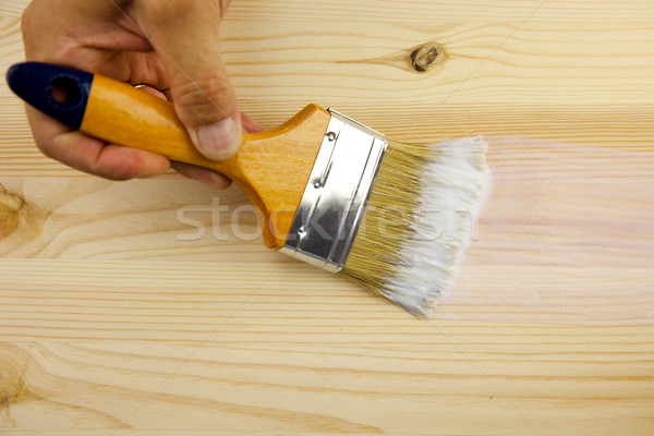 Stock photo: Wood texture, hand and paintbrush / covering by varnish