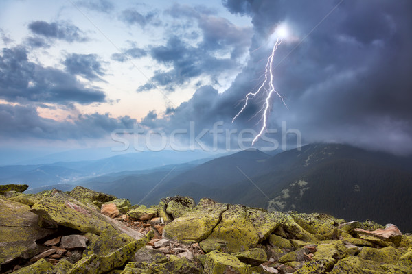 Onweersbui bliksem dramatisch wolken bergen hemel Stockfoto © Taiga