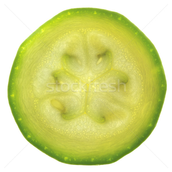 Slice of zucchini or courgette isolated on white / back-lit Stock photo © Taiga