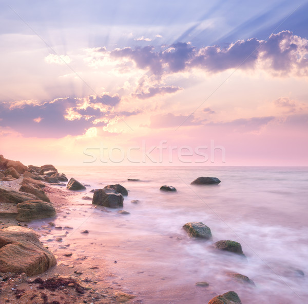 Dawn sunrise landscape over beautiful rocky coastline in the Sea Stock photo © Taiga
