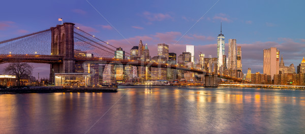 Panorama of Brooklyn Bridge and Manhattan skyscrapers at sunrise Stock photo © Taiga